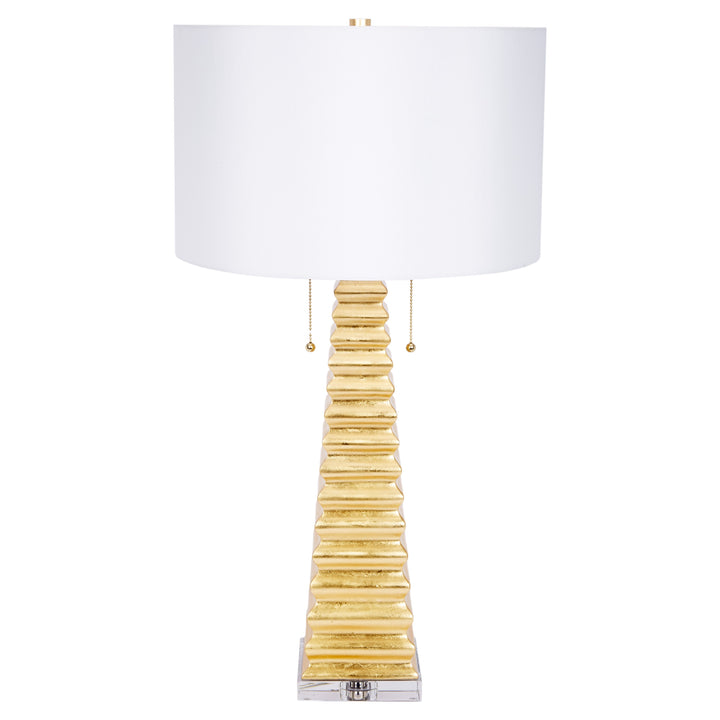 Elegant Jonas table lamp featuring a gold base with white linen shade, perfect for bedrooms, living rooms, or office spaces.