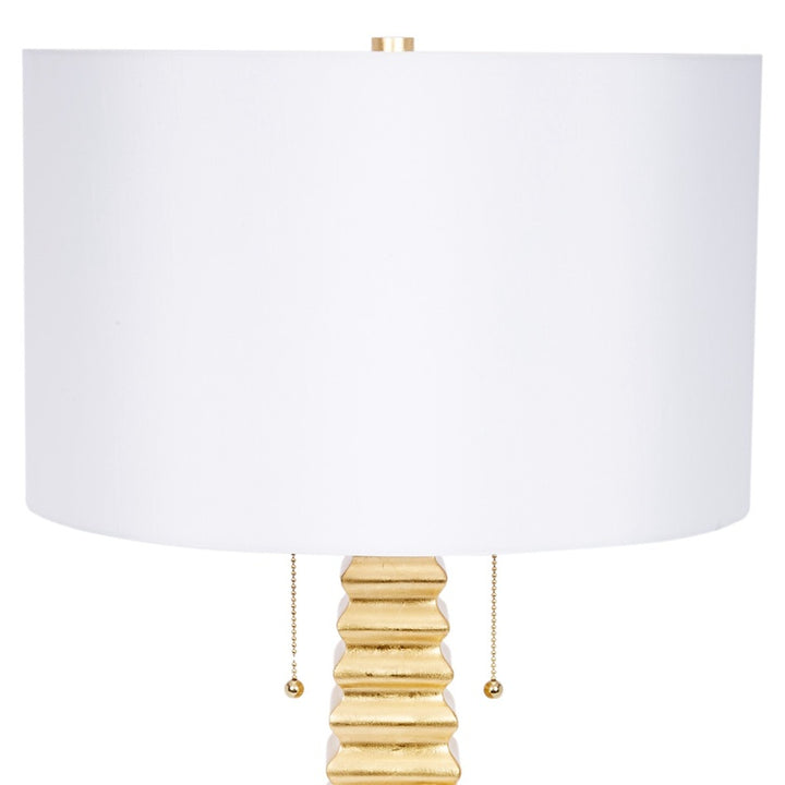 Jonas gold table lamp with white linen drum shade and ribbed gold column base