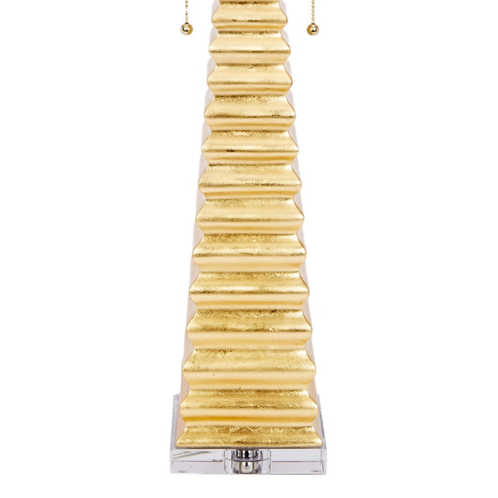 Jonas gold table lamp base view: chrome socket and ribbed gold stem