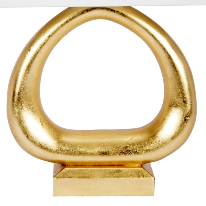 Gold table lamp metal loop and rectangular pedestal base detail