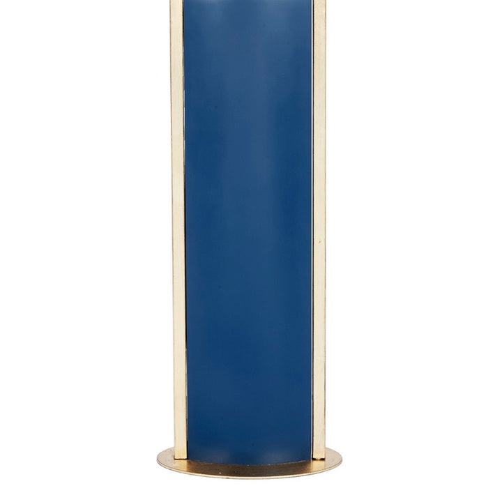 Blue column base table lamp with gold metal frame, shade not visible.