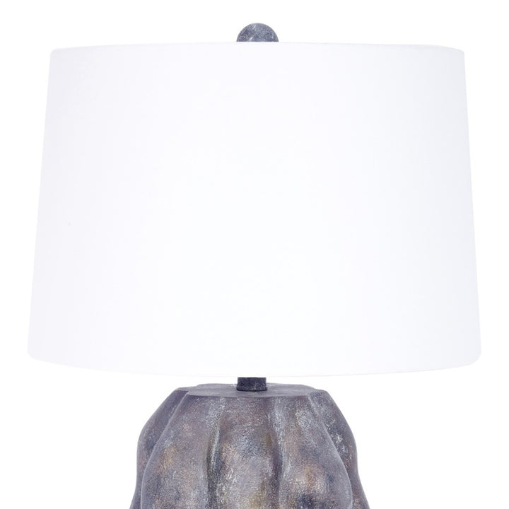 Table lamp with white fabric shade and gray textured base