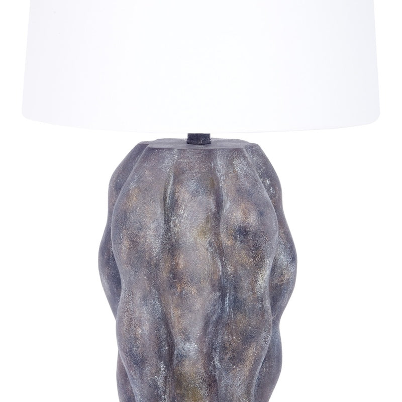 Table lamp with white linen shade over gray mottled base