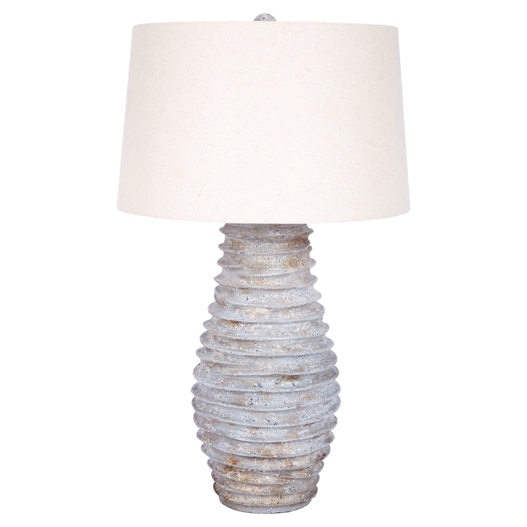 Elegant Antonio table lamp with distressed finish and linen shade, perfect for bedrooms, living rooms, or office spaces.