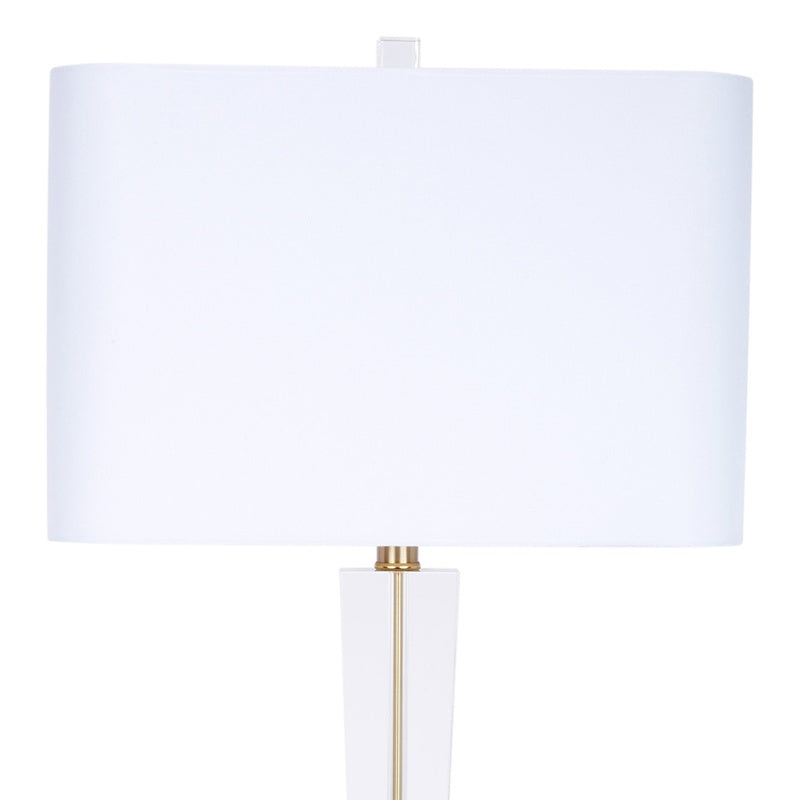 White linen crystal table lamp with cylindrical shade and brass-toned stem
