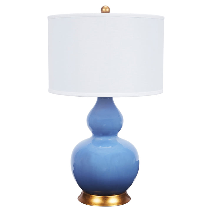 Elegant Parisian blue porcelain lamp featuring a linen shade, perfect for bedrooms, living rooms, or office spaces.
