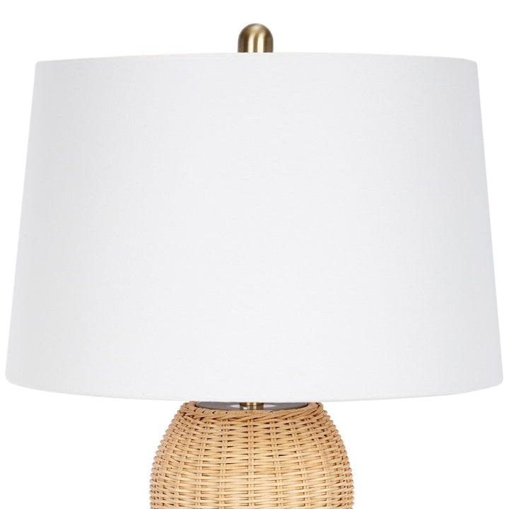 Estella rattan table lamp with white drum shade over woven beige base