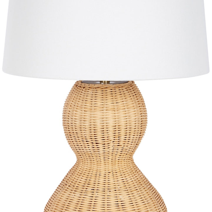Estella rattan table lamp close-up: white linen shade and woven beige base
