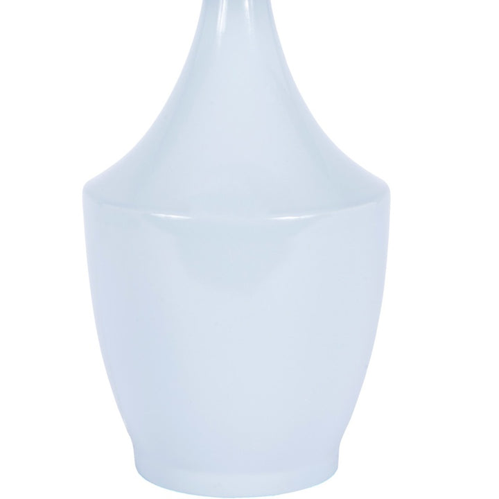 Blue ceramic table lamp with white fabric shade and vase-style base