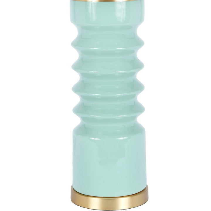 Lennon celadon ceramic table lamp close-up of ribbed body and brass base ring