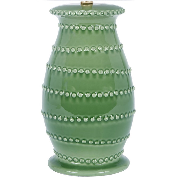 Green ceramic table lamp with white drum shade and vertical beaded trim
