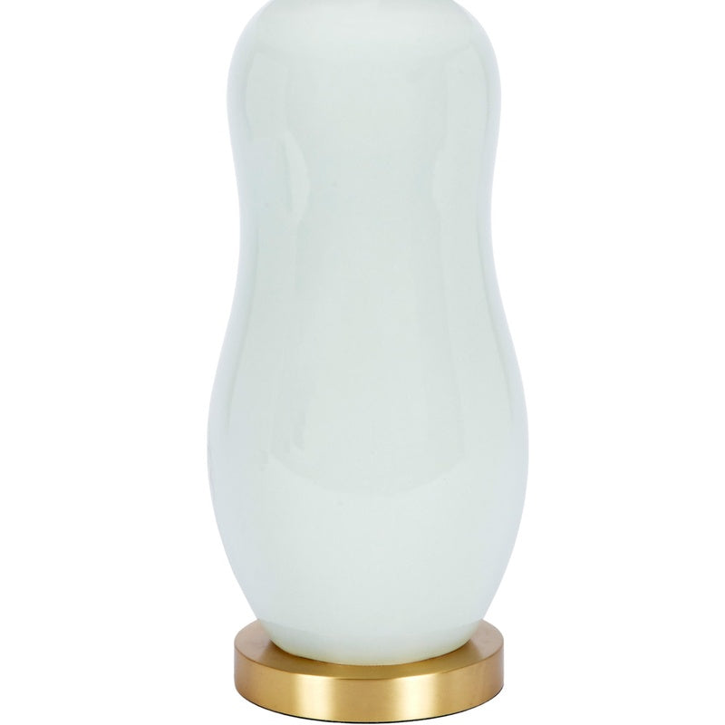Mint green ceramic table lamp with white drum shade and brass base ring