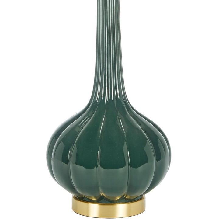 Dark green rounded ceramic lamp base with gold collar and white drum shade