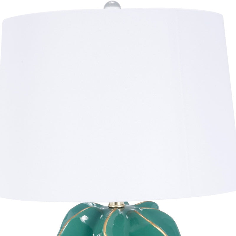Emerald green ceramic wave lamp with white fabric shade and brass finial
