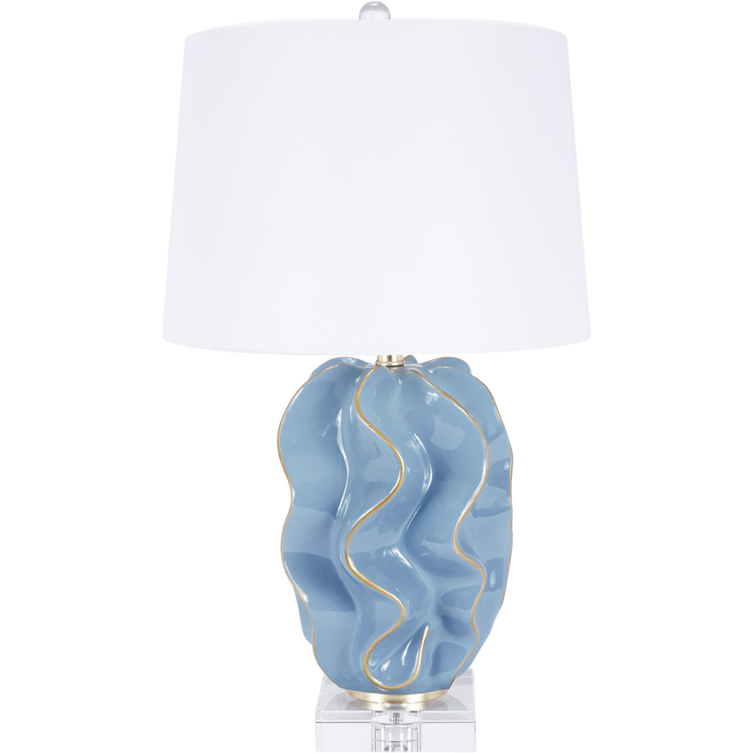 Elegant Hannah table lamp in Parisian blue ceramic with wave design, perfect for bedrooms, living rooms, or office spaces.