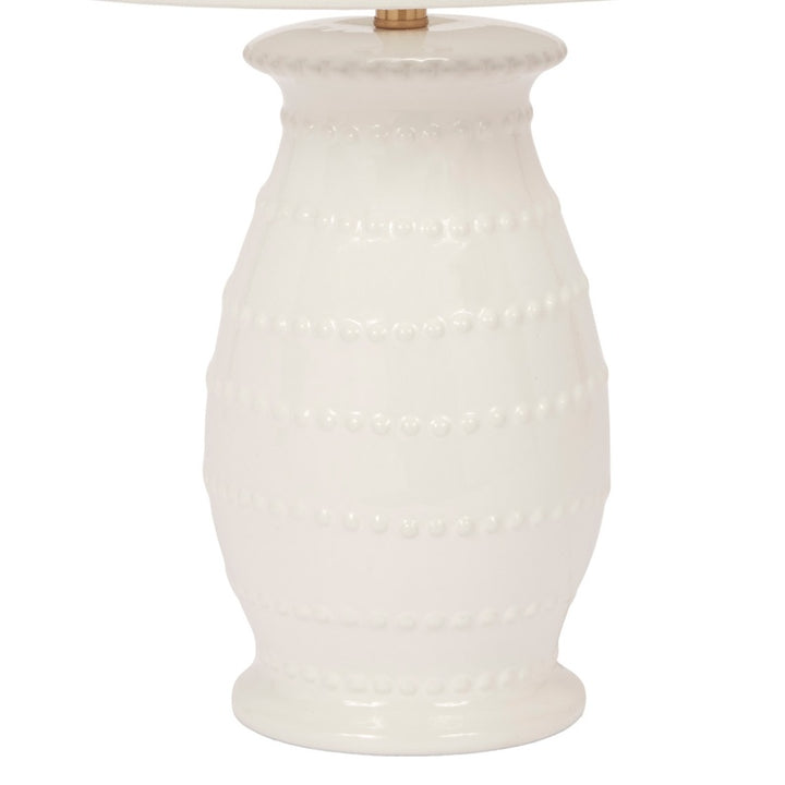 Ceramic table lamp with white fabric shade and textured white vase-style base