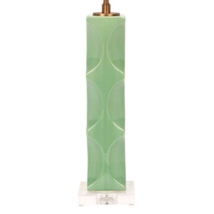 Green ceramic table lamp with white linen drum shade, brass hardware and square base