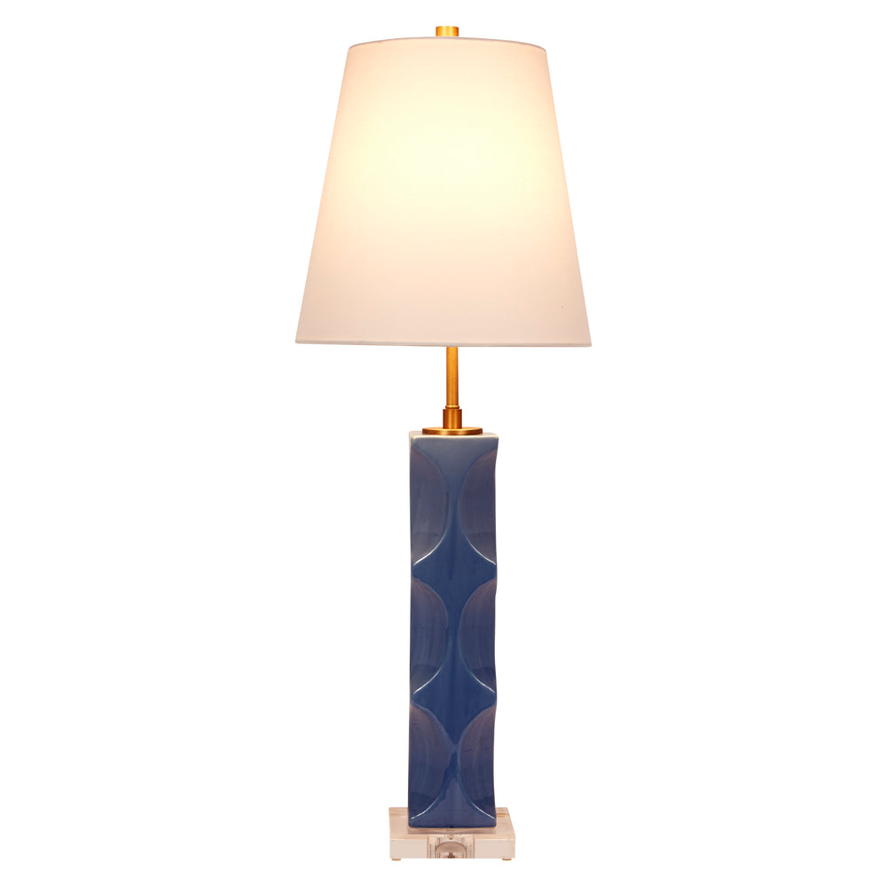 Charming Parisian blue ceramic lamp with a white linen shade, adding timeless elegance and soft color to any space.