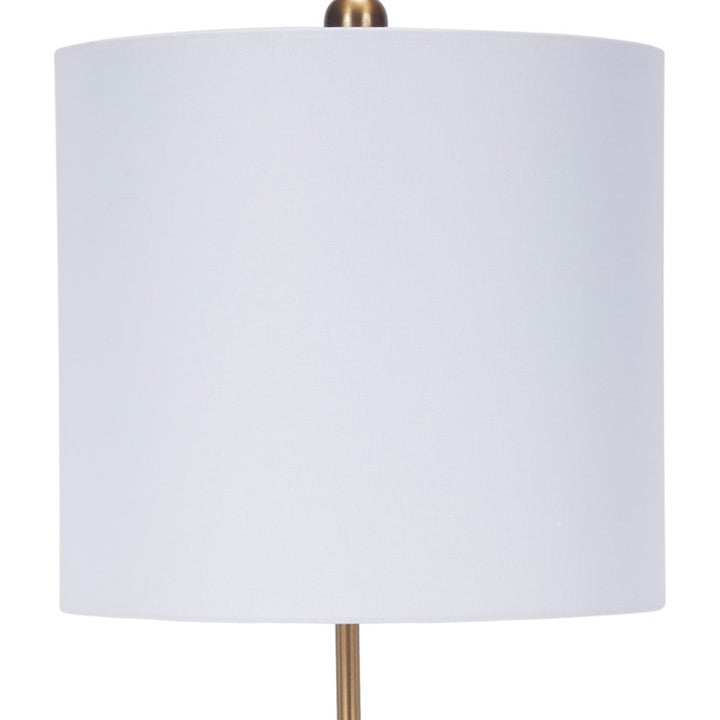 White drum shade table lamp with brass stem