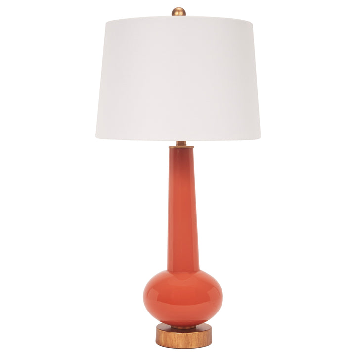 Orange buffet table lamp with white linen shade and brass-toned accents, wood base.