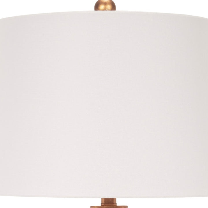 White linen drum shade with brass socket cap for orange buffet table lamp.
