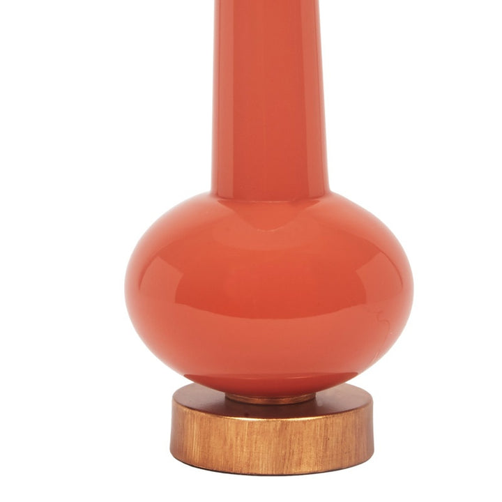 Orange lamp base with round wood pedestal and brass socket collar for shade.