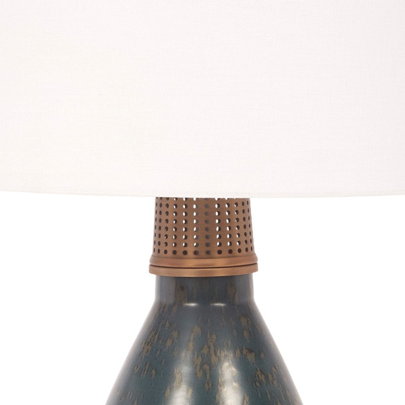 Ceramic table lamp with perforated brass shade and blue patina base