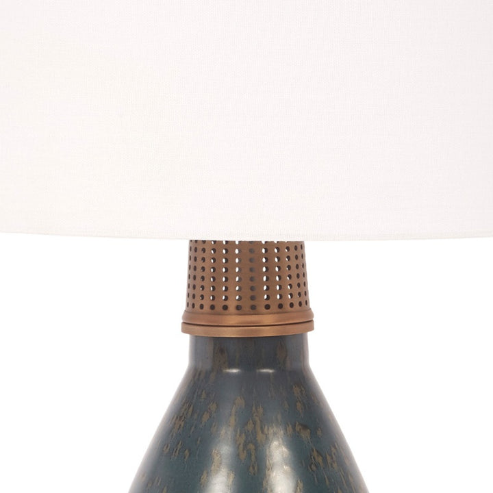 Ceramic table lamp with perforated brass shade and blue patina base
