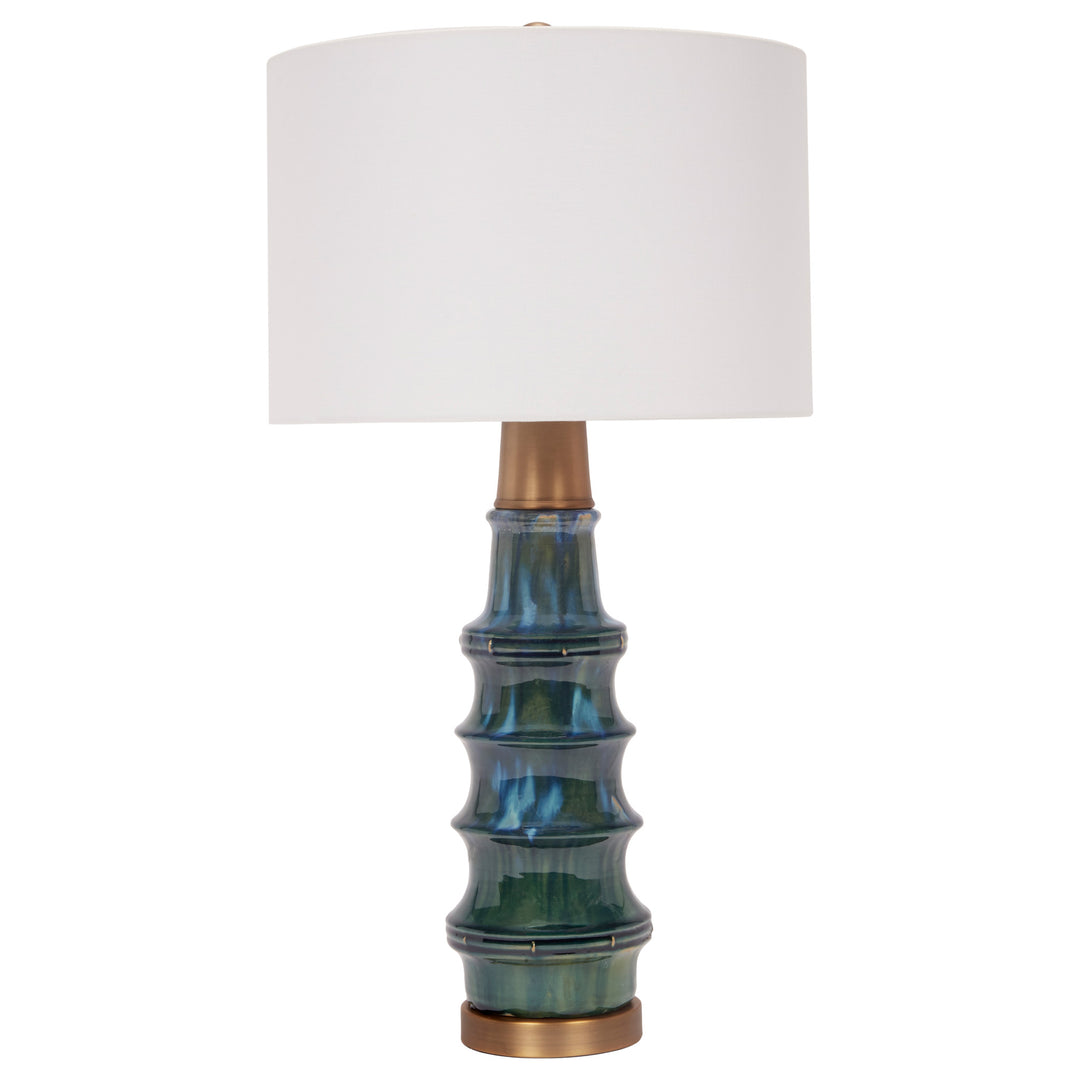 Elegant peacock green ceramic lamp featuring brass accents, perfect for living rooms, bedrooms, or office spaces.