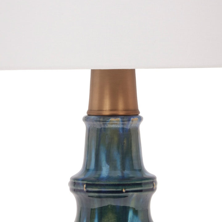 Peacock green ceramic lamp with brass accents, tapered neck and blue-green body