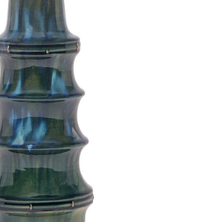 Peacock green ceramic lamp with glossy blue-green glaze and horizontal brass accent bars