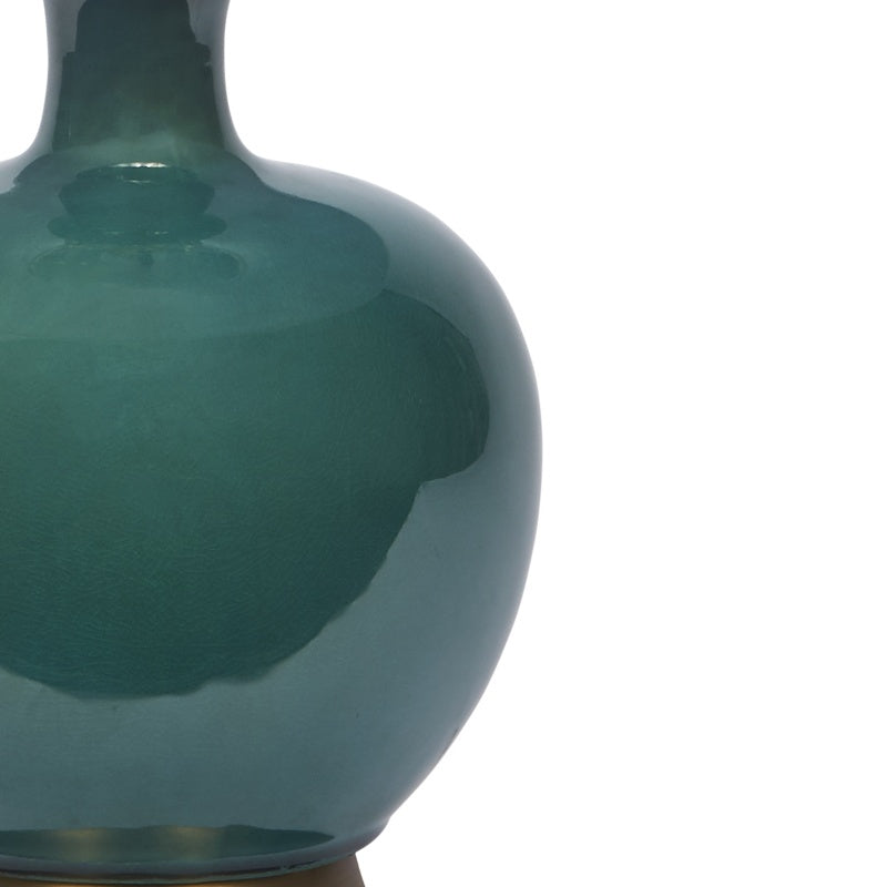 Dark green ceramic table lamp body close-up with reflective finish