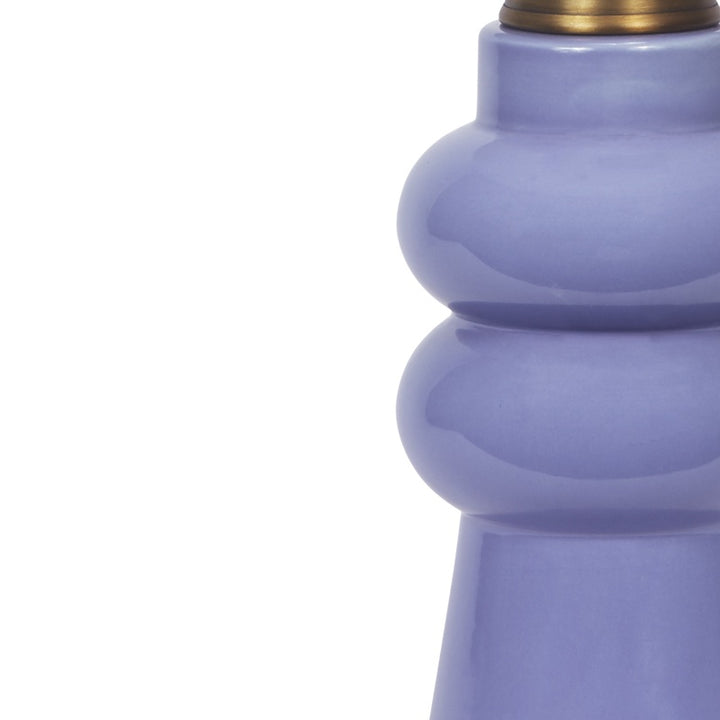 Lavender ceramic lamp base with rounded ridges and brass-toned neck