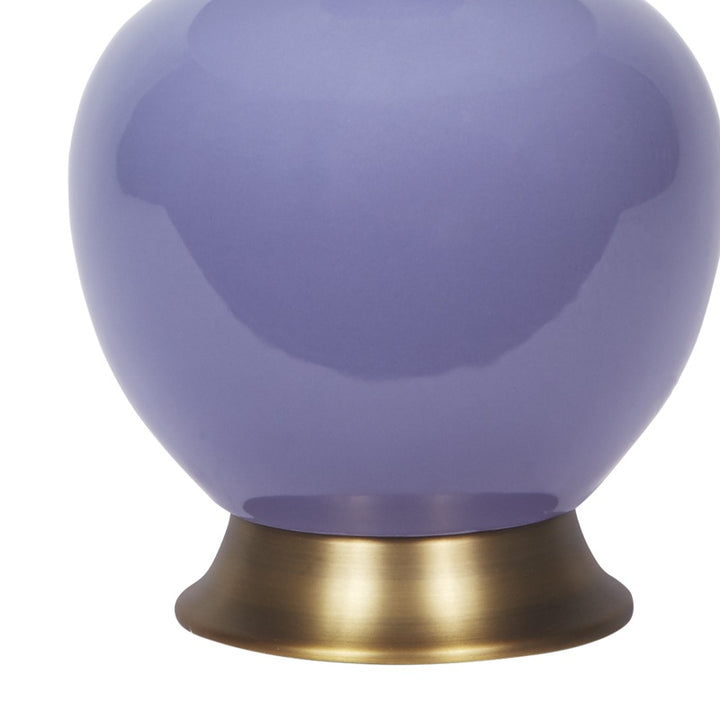 Lavender ceramic table lamp with white fabric shade and brass base