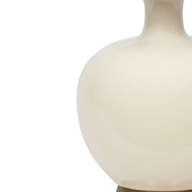 Cream ceramic globe-shaped table lamp body, close-up
