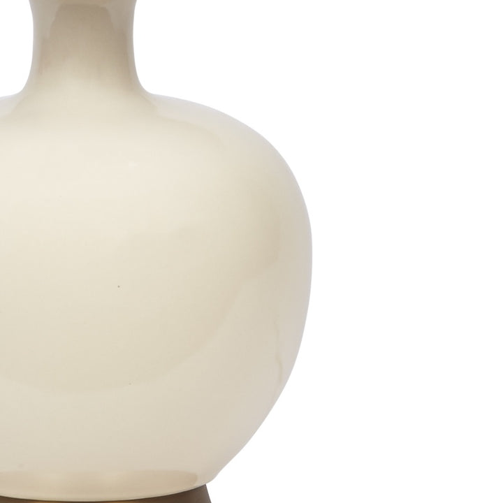Cream ceramic table lamp body close-up with curved profile