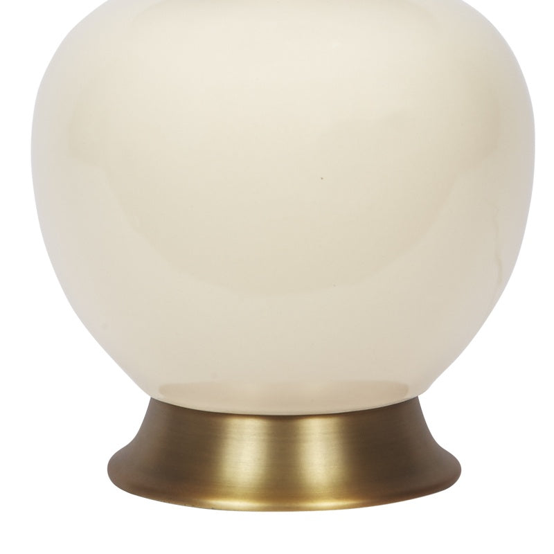 Cream ceramic table lamp with brass base ring and white linen shade