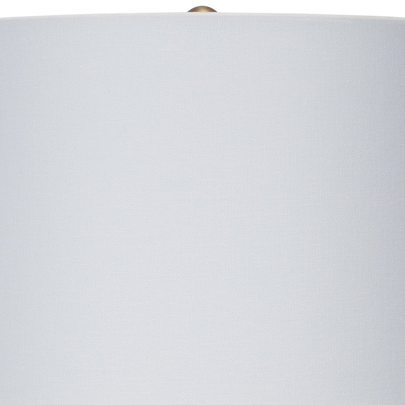 Ceramic table lamp with white drum lampshade and brass finial