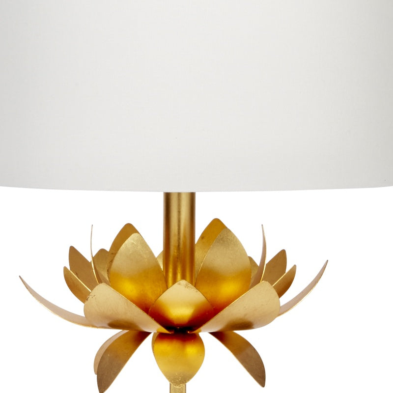 Gold lotus-style finial on gold stem beneath white linen shade
