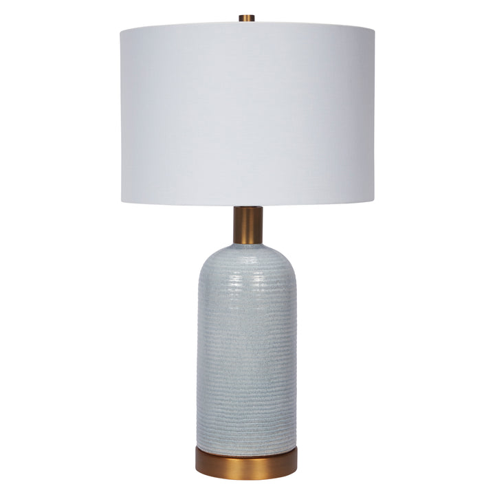 Elegant sky blue ceramic table lamp with a polished brass base, perfect for modern home interiors.