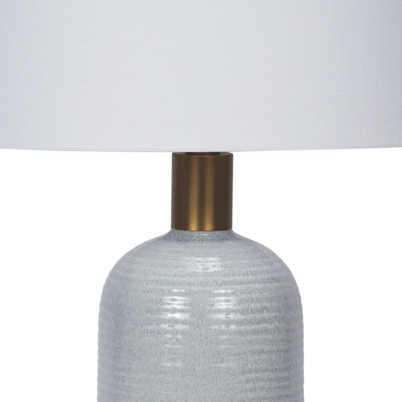 Light blue textured ceramic table lamp with brass neck and base collar