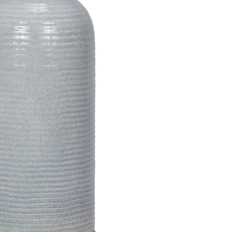 Light blue ribbed ceramic lamp body close-up