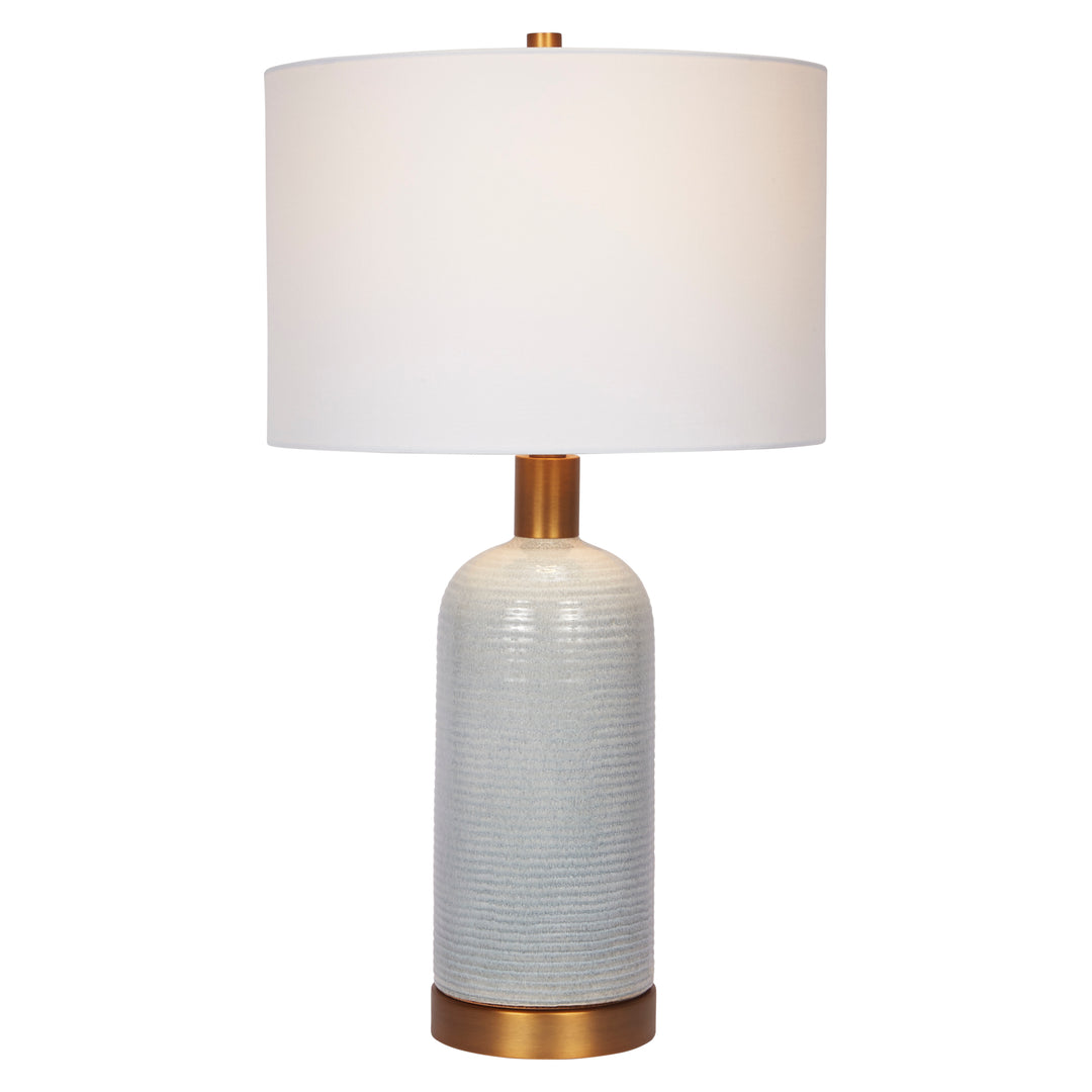 Charming sky blue ceramic lamp with a shiny brass base, adding color and warmth to any room décor.