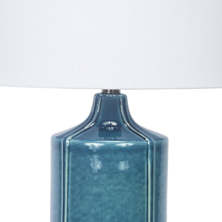 Teal ceramic table lamp base with metal socket and white shade