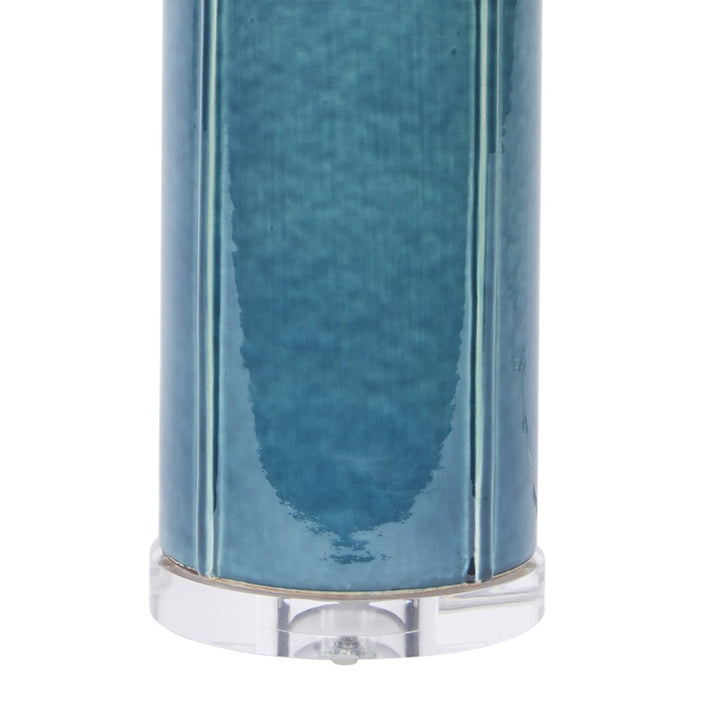 Teal ceramic lamp base with clear round mounting and reflective trim