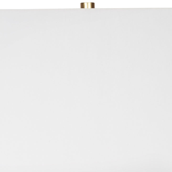 Table lamp with white drum shade and gold metal frame