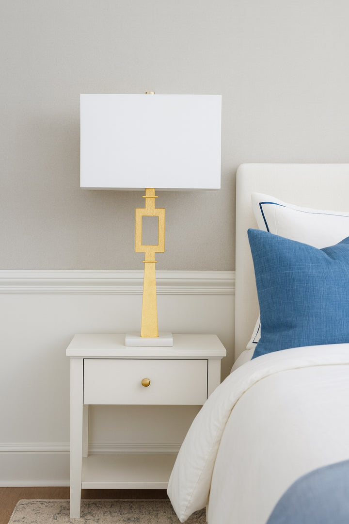 Gold Leaf Faith lamp with white marble base.