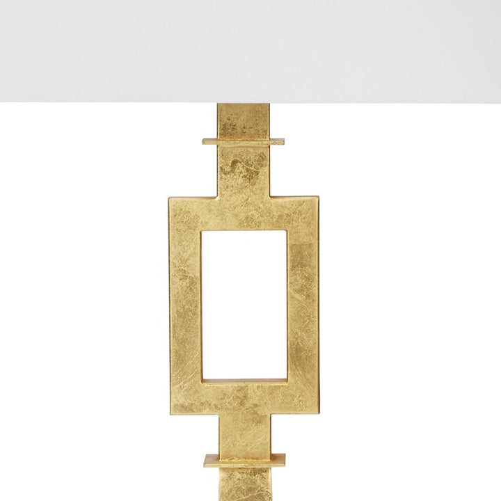 Gold faith lamp showing gold leaf cross with rectangular cutout and white top shade