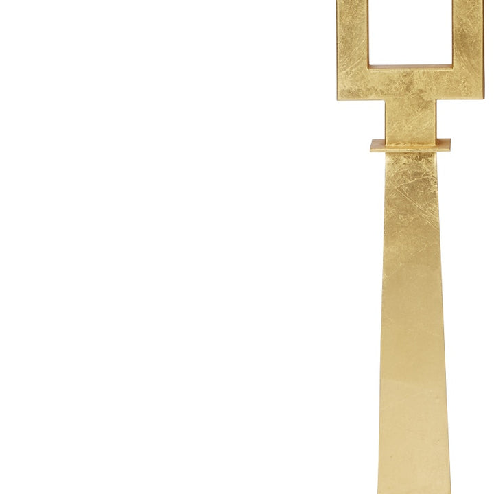 Gold leaf cross stand with open rectangular frame above white square lampshade