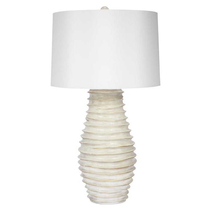 Elegant cream and gold-washed lamp featuring a white linen shade, ideal for modern or classic home decor.